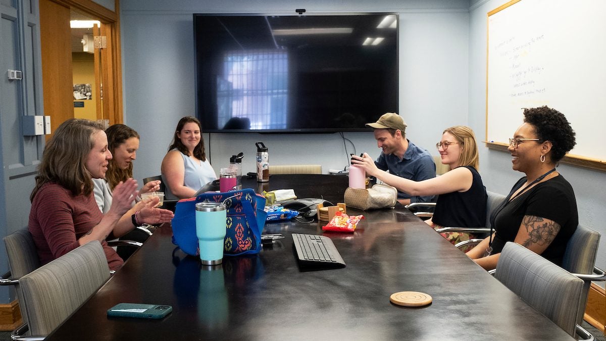 A group of people gathered in a conference room.