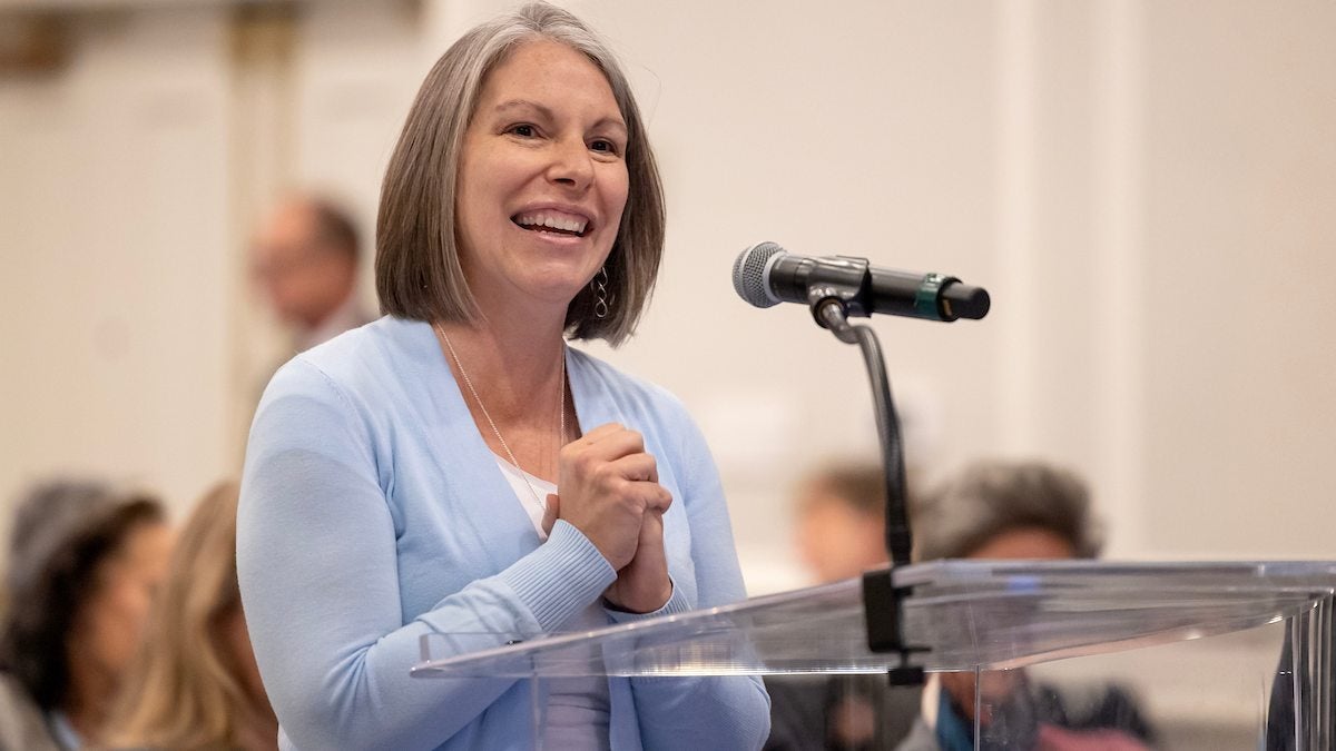 Woman speaking at a meeting.