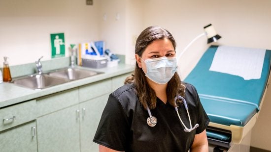 Jenna Pauli in COVID-19 mask in doctor's office.