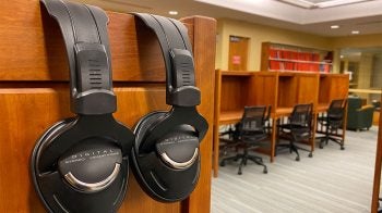 Two pairs of headphones in the foreground.