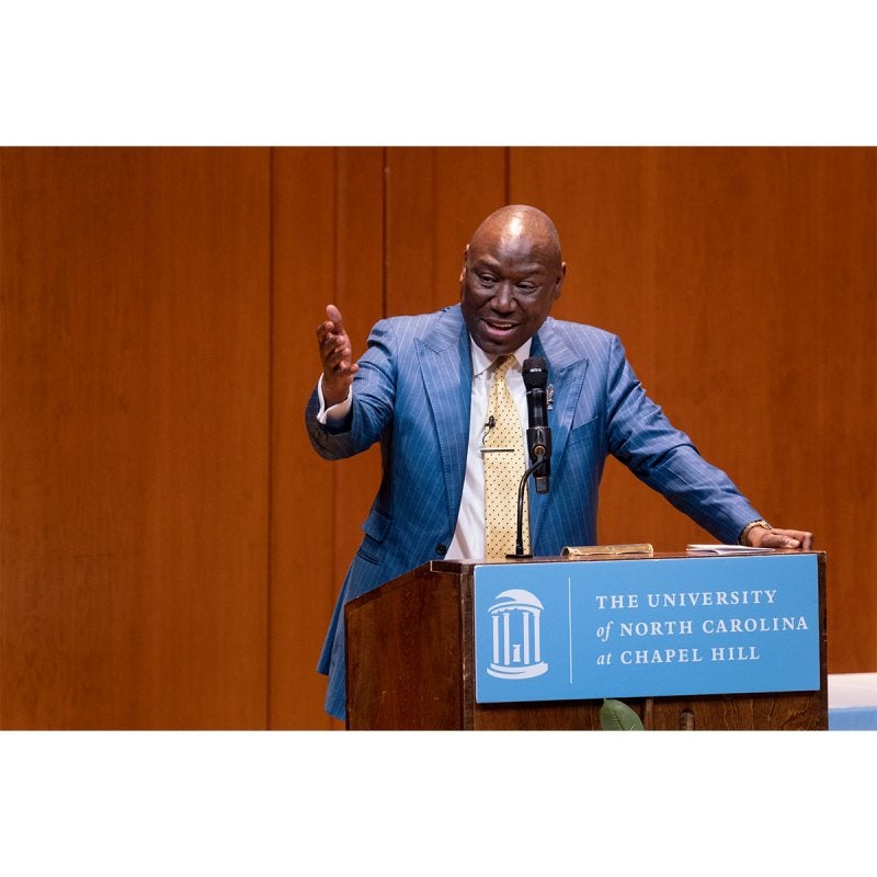 Ben Crump speaking at a dais.