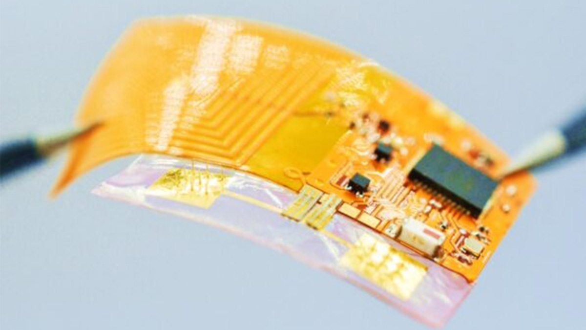 Close-up image of wearable patch with pieces of bits of tech exposed.