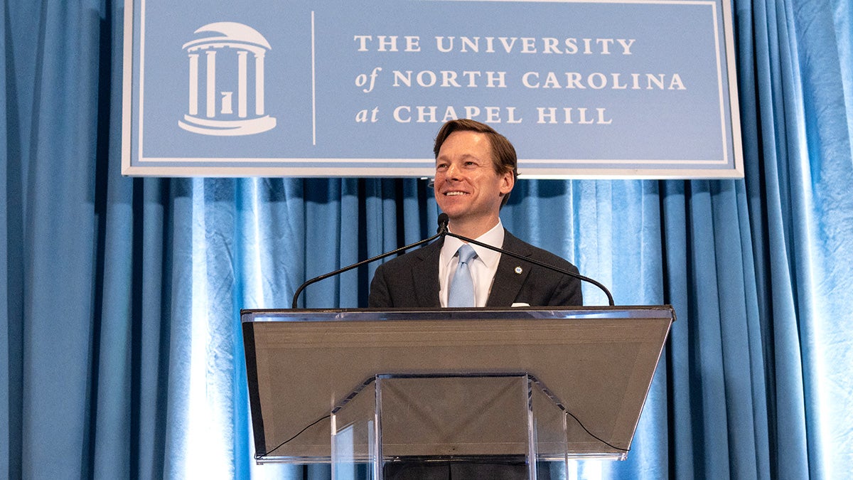 Lee Roberts speaking at a lectern