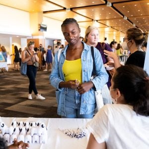 Woman standing at an information table
