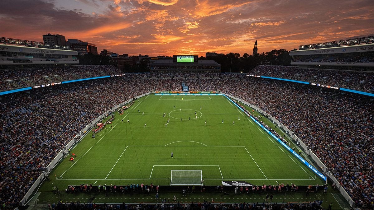 Kenan Stadium at sunset hosting an international soccer match.