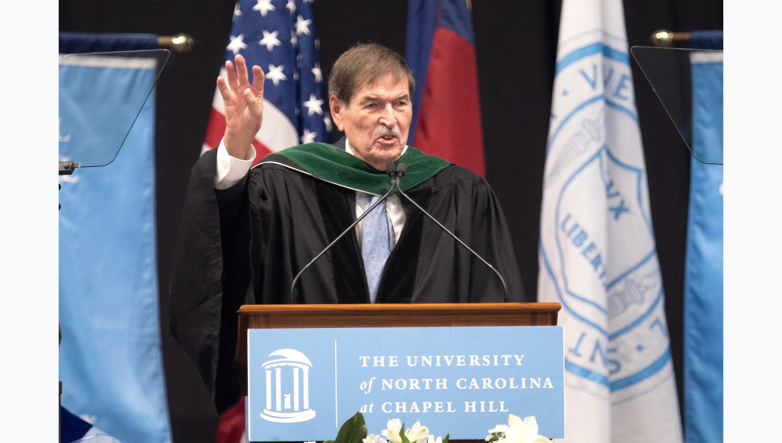 Dr. Shelley Earp speaking from a podium at U.N.C. Chapel Hill's Winter Commencement