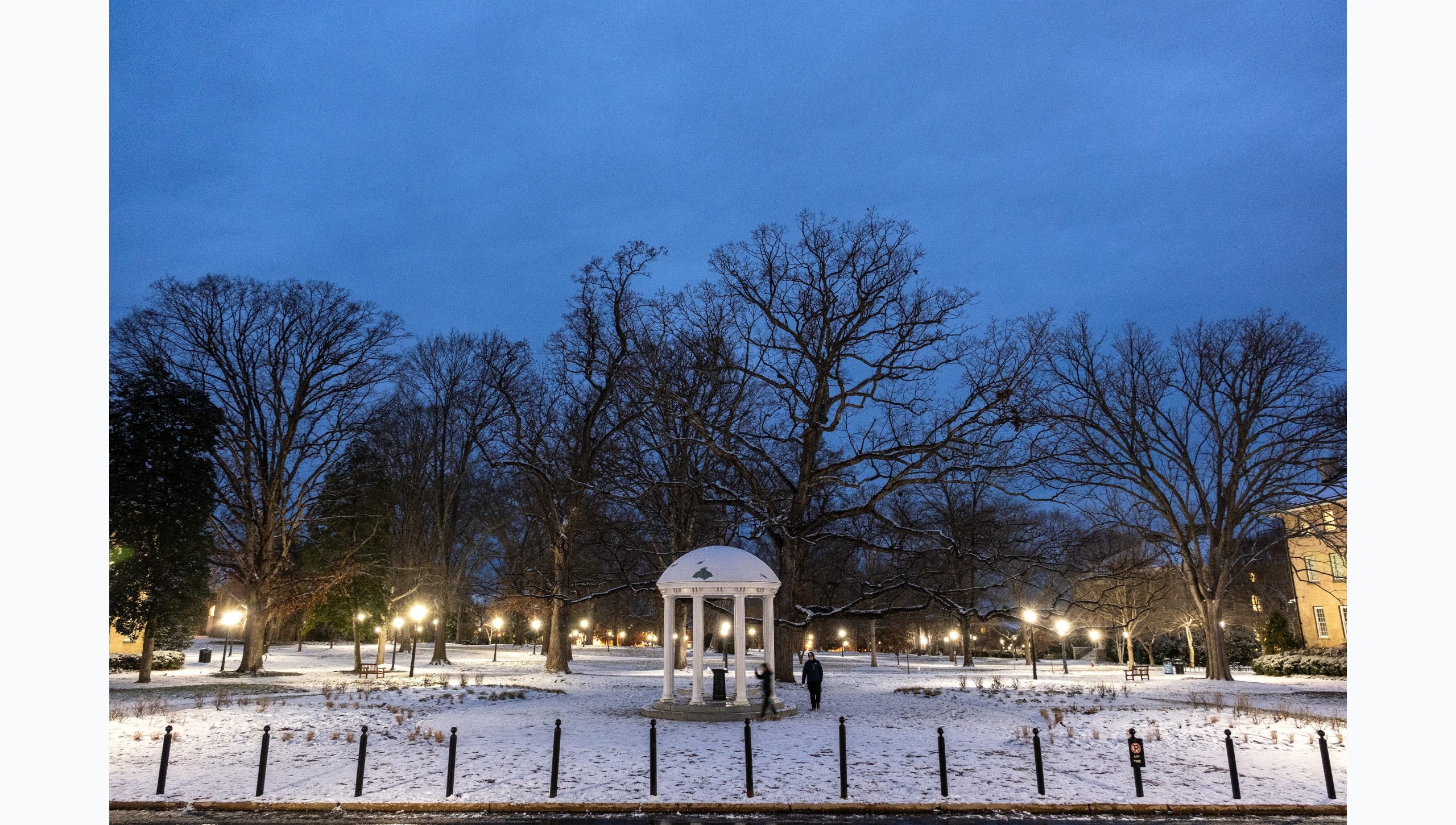 Dawn photo of snow-covered Old Well on the campus of U.N.C Chapel Hill.