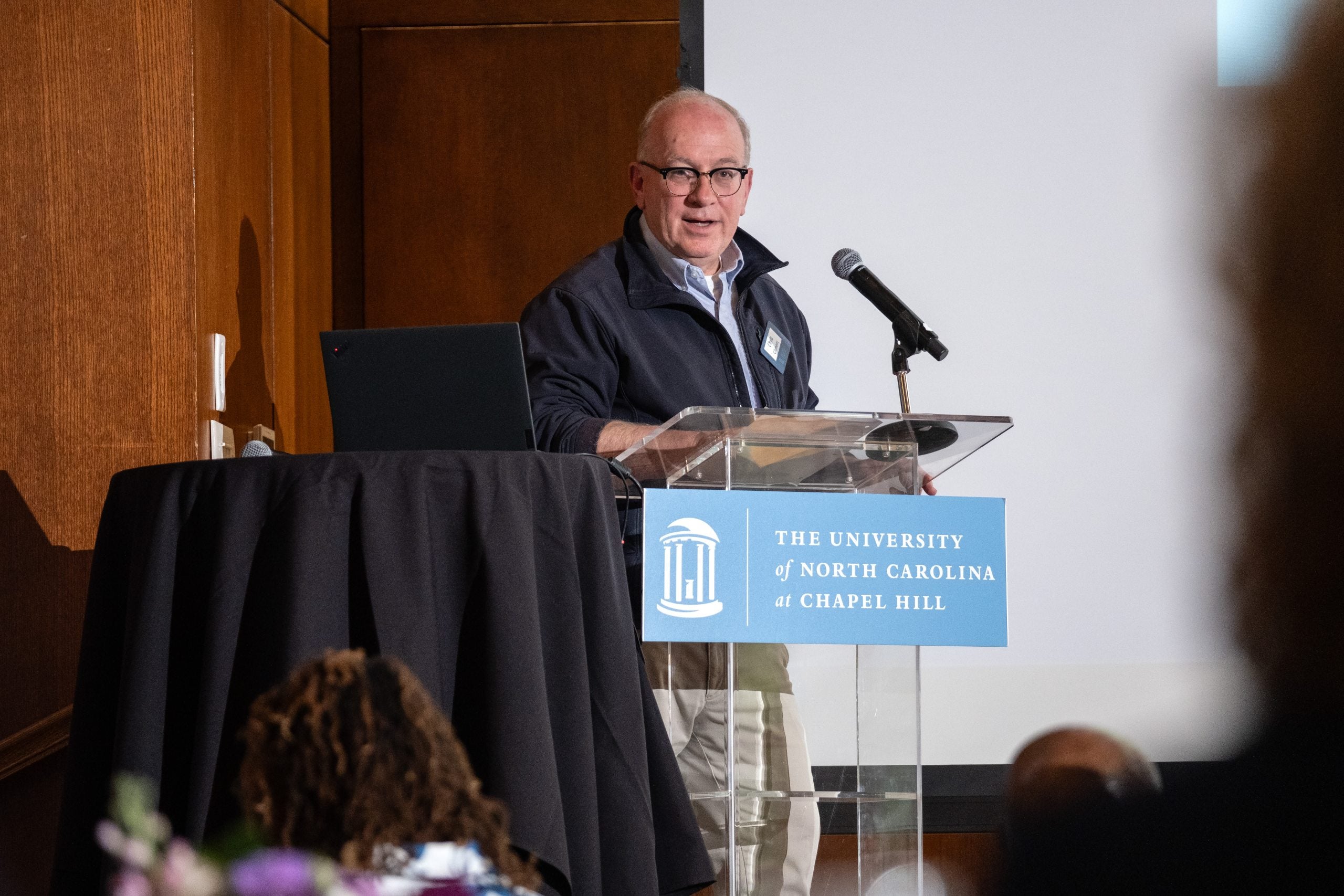 Chris Clemens speaks at a lectern.
