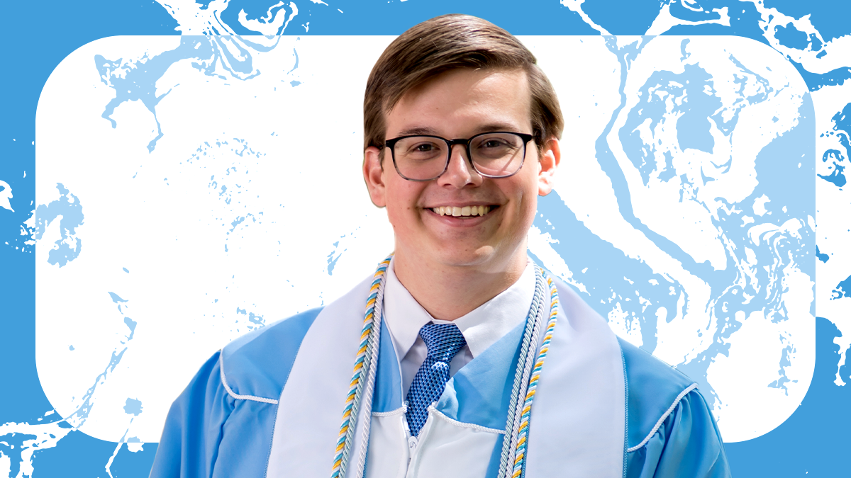 Headshot of Matthew Tweded wearing commencement robes.