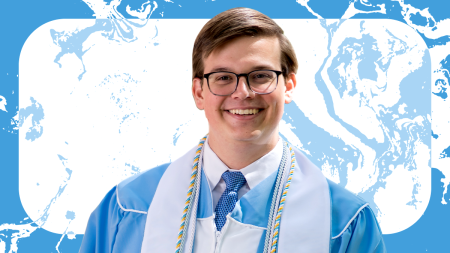 Headshot of Matthew Tweded wearing commencement robes.