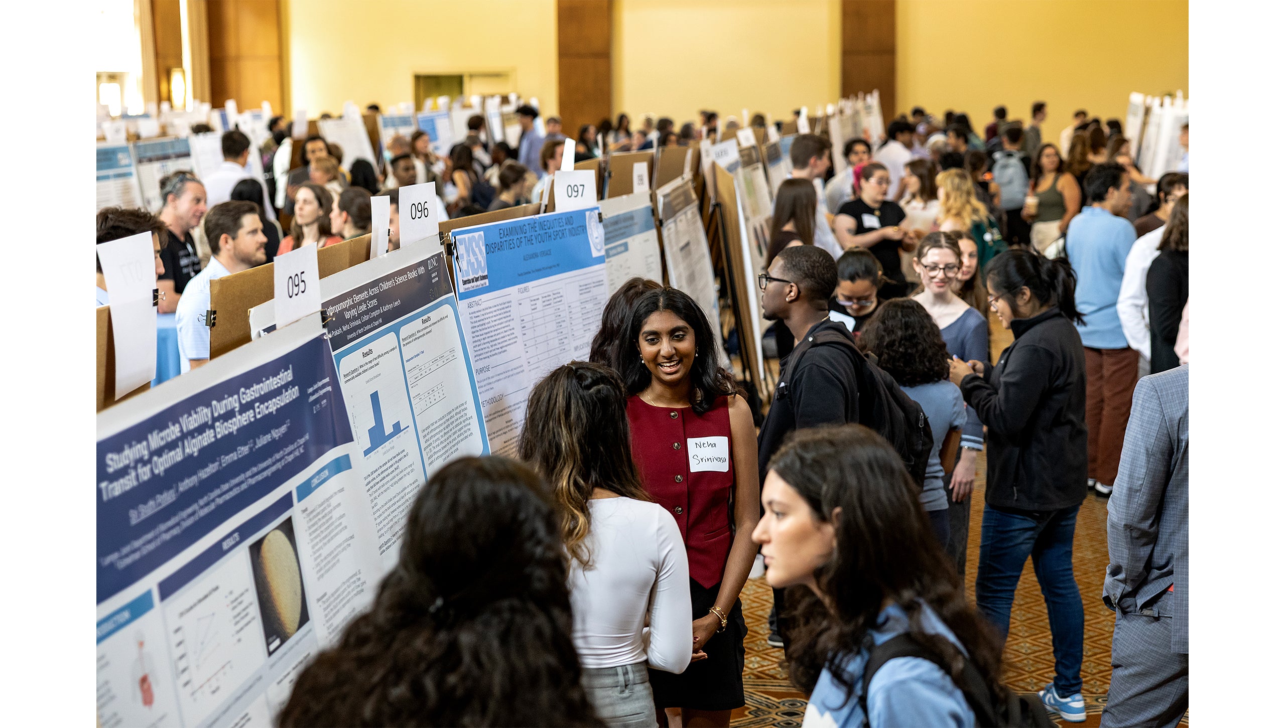Students explain their research at a poster session during the Celebration of Undergraduate Research