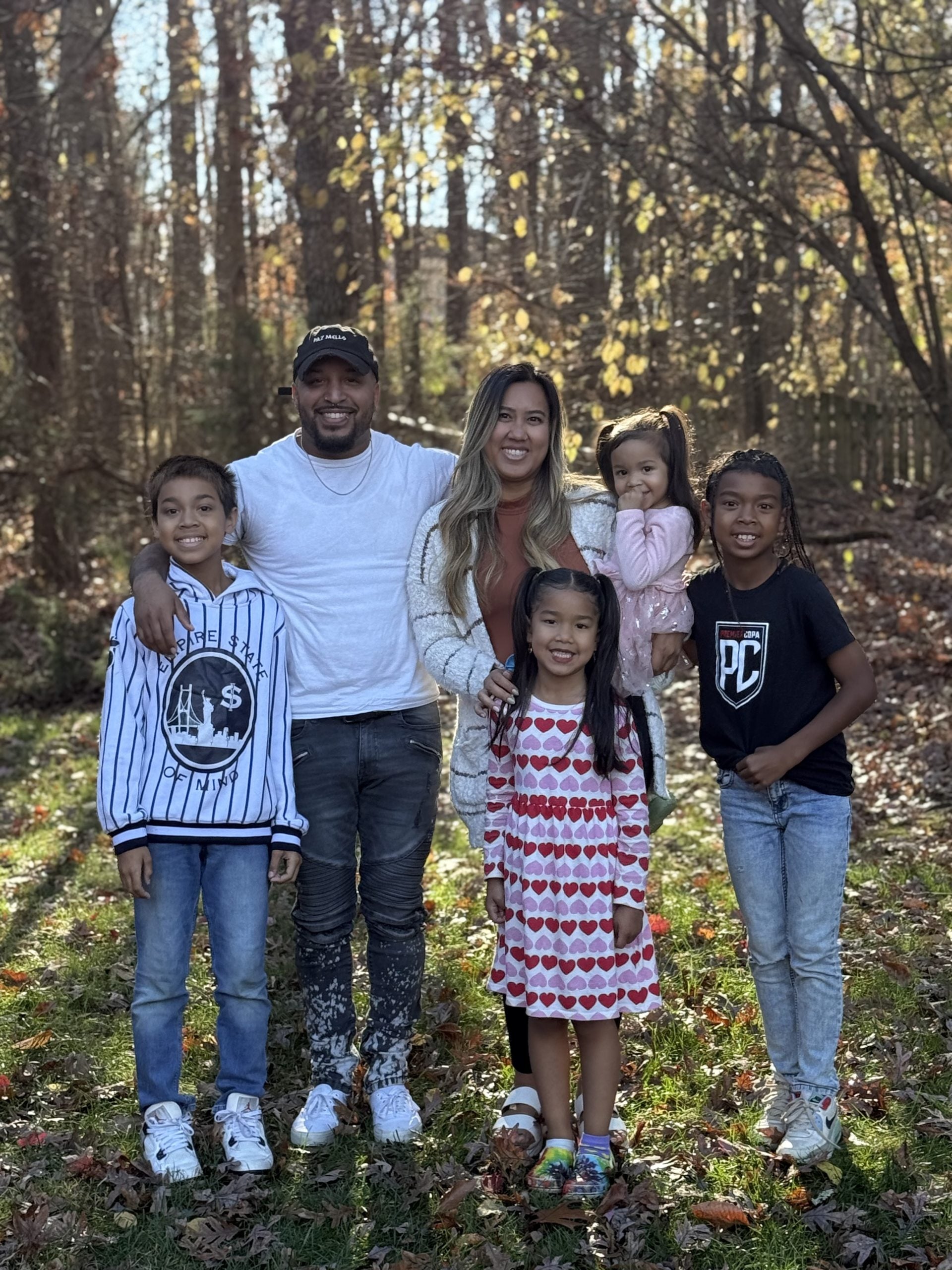 Patrick Clifford poses with his fiancée and four children.