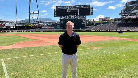 Nathan Townsend standing in the outfield on baseball field.