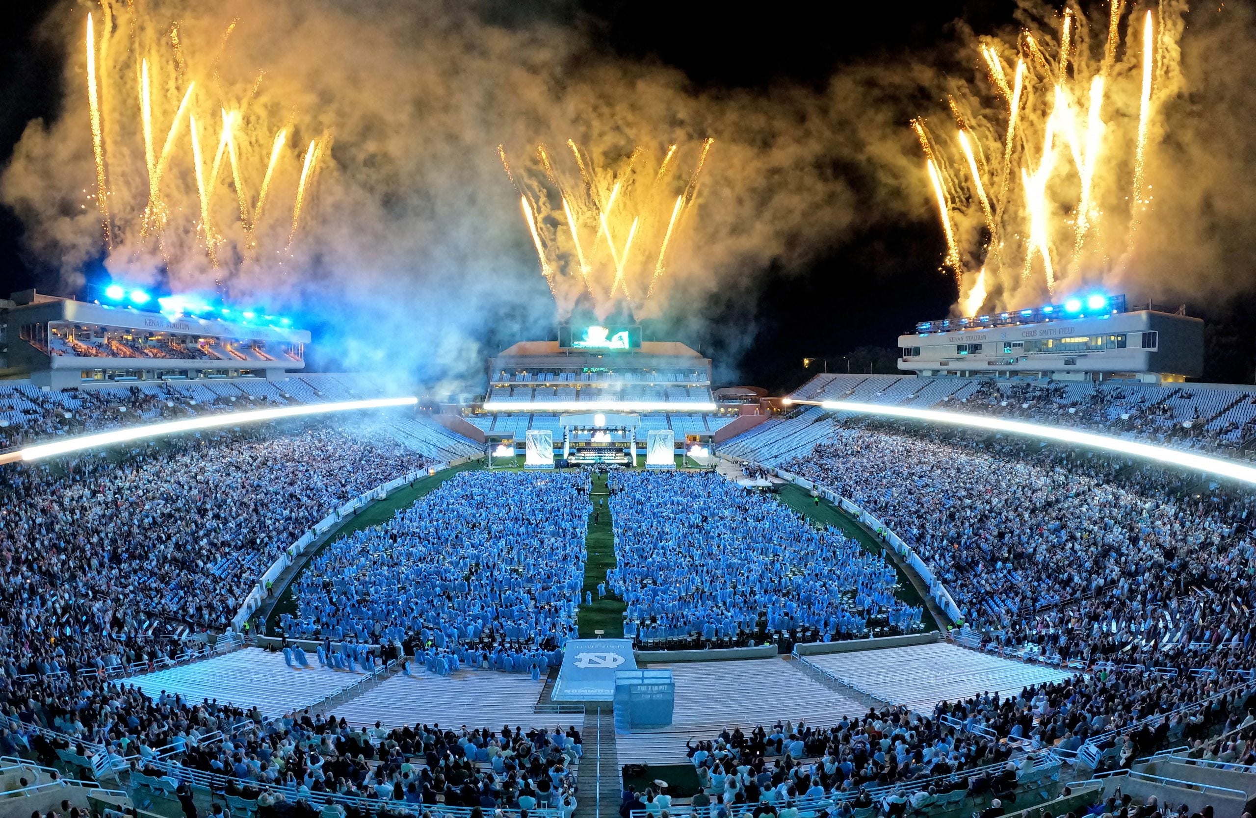 Fireworks go off around Kenan Stadium at the end of 2025 Spring Commencement.