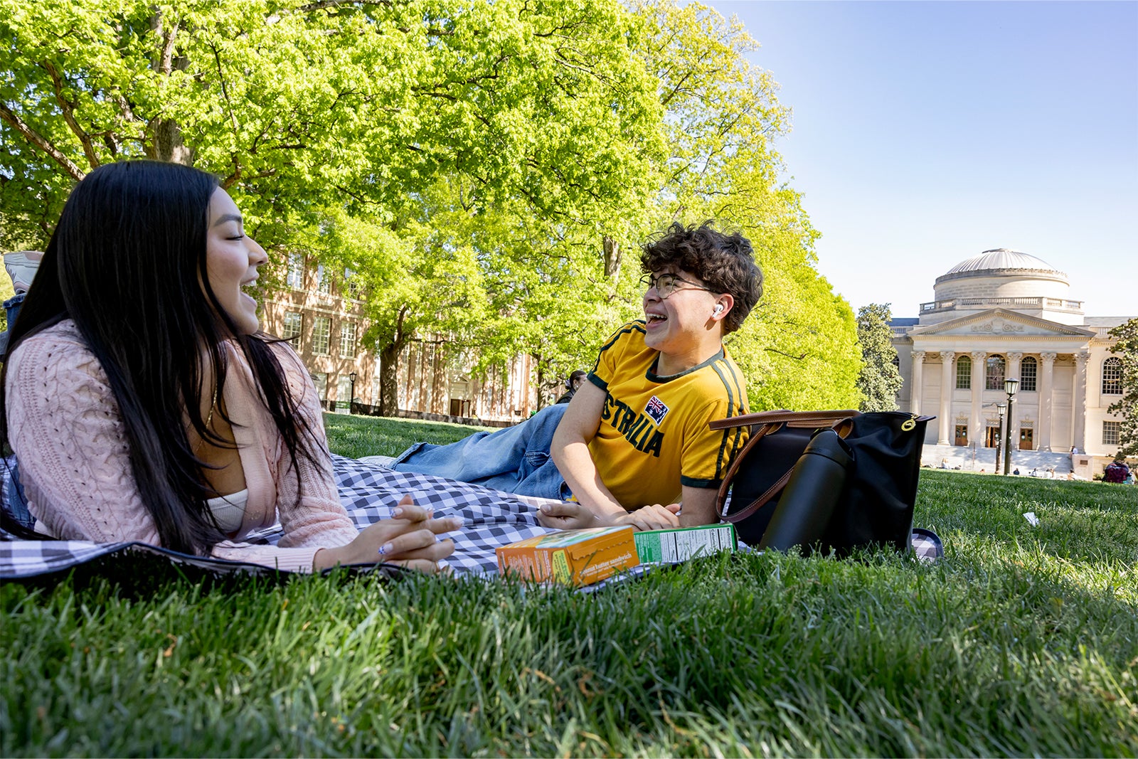 Students lay on the grass on Polk Place