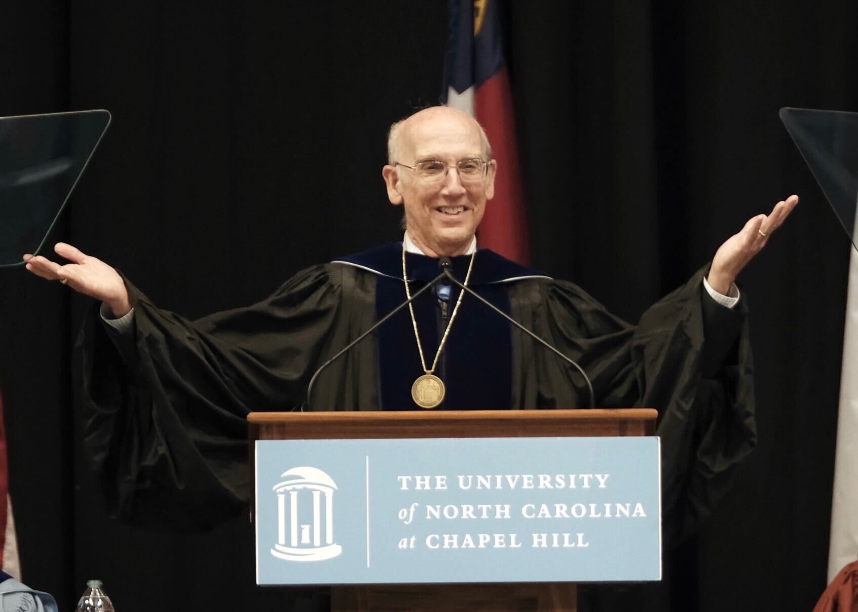 Don Baucom speaks to graduate students at the Doctoral Hooding ceremony.