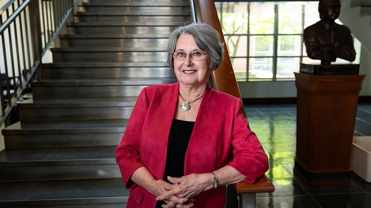Gail Moriarty standing in front of staircase.
