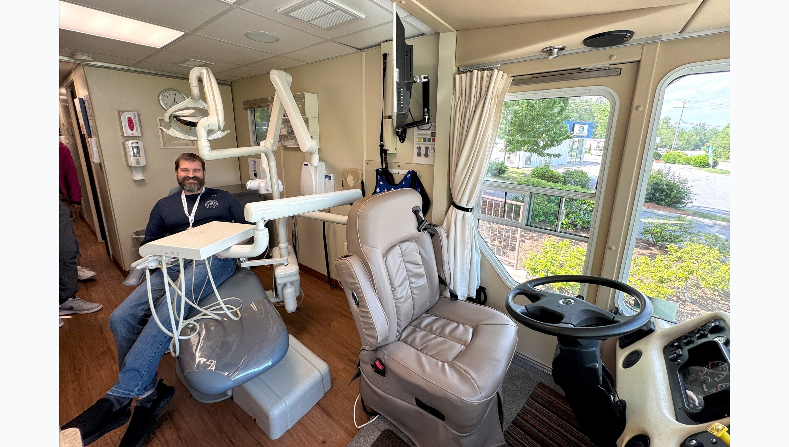 Tar Heel Bus Tour participant inside a mobile dental clinic.