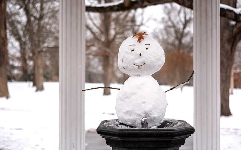 Snowman on the fountain at the Old Well
