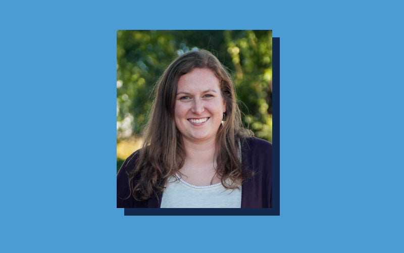 Portrait of Lauren Grimley atop a Carolina Blue background.