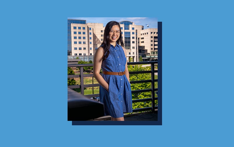 Portrait of Elizabeth Kwong atop a Carolina Blue background.