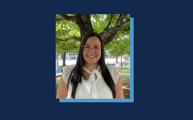 Portrait of Laura Chaves Cerdas atop a Navy blue background.