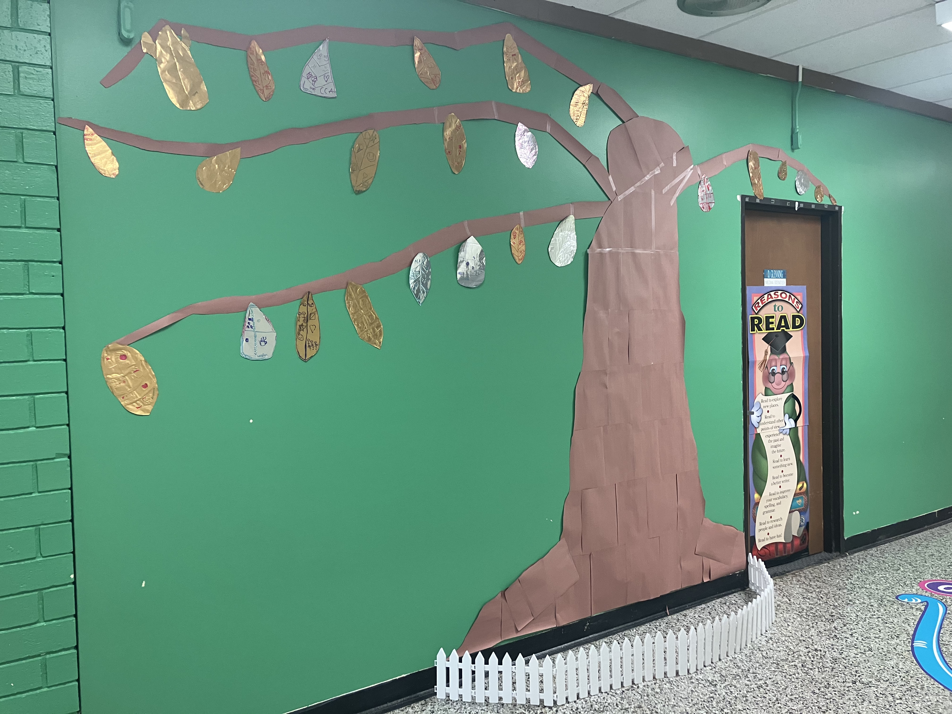 A tree mural created by second graders at Carolina Community Academy