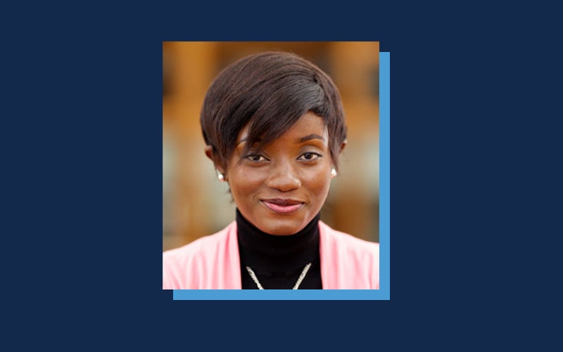Portrait of Olufeyisayo Odebunmi atop a Navy blue background.