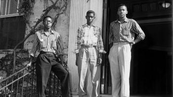 Leroy Frasier, John Lewis Brandon and Ralph Frasier standing and posing on the steps of South Building.
